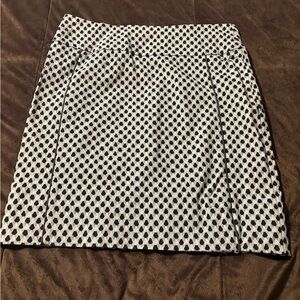 Straight, stretchy, just above knee navy blue, light green and white.